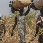 South Sudan conflict scene showing UN peacekeeper and displaced civilians
