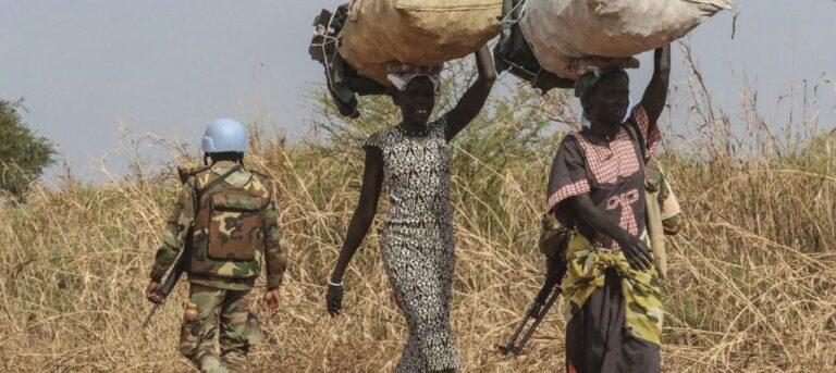 South Sudan conflict scene showing UN peacekeeper and displaced civilians